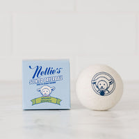 Nellie's Bergamot Scented Dryerball made with pure lavender essential oil beside Nellie's Bergamot Scented Dryerball packaging
