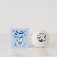 Nellie's Lavender Scented Dryerball made with pure lavender essential oil beside Nellie's Lavender Scented Dryerball packaging