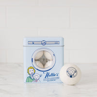 Four wool dryerballs in adorable dryer shaped tin that doubles as a piggy bank