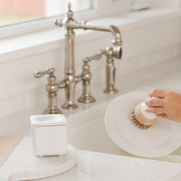 nellies dish butter and nellies forever brush being used to clean dishes