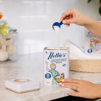 Scooping 100 load laundry detergent in tin