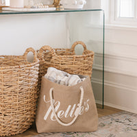Brown jute tote bag with rope handles with blanket inside