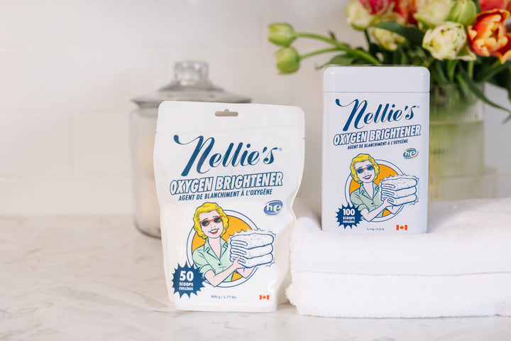 Nellie's Oxygen Brightener Tin and Pouch on counter.