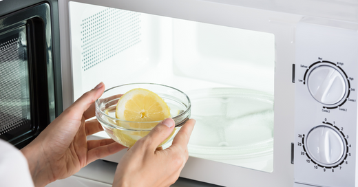 Cleaning the microwave with lemon.