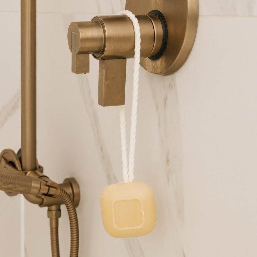 Soap on a Rope hanging on shower faucet