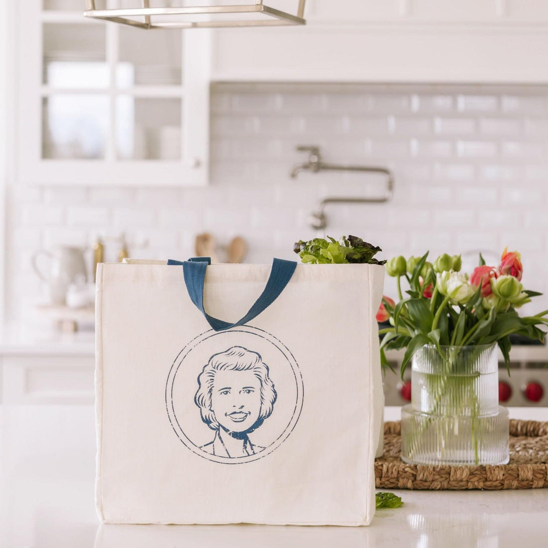 Nellie's cream coloured tote with logo face on counter